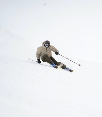 skier sliding down a slope